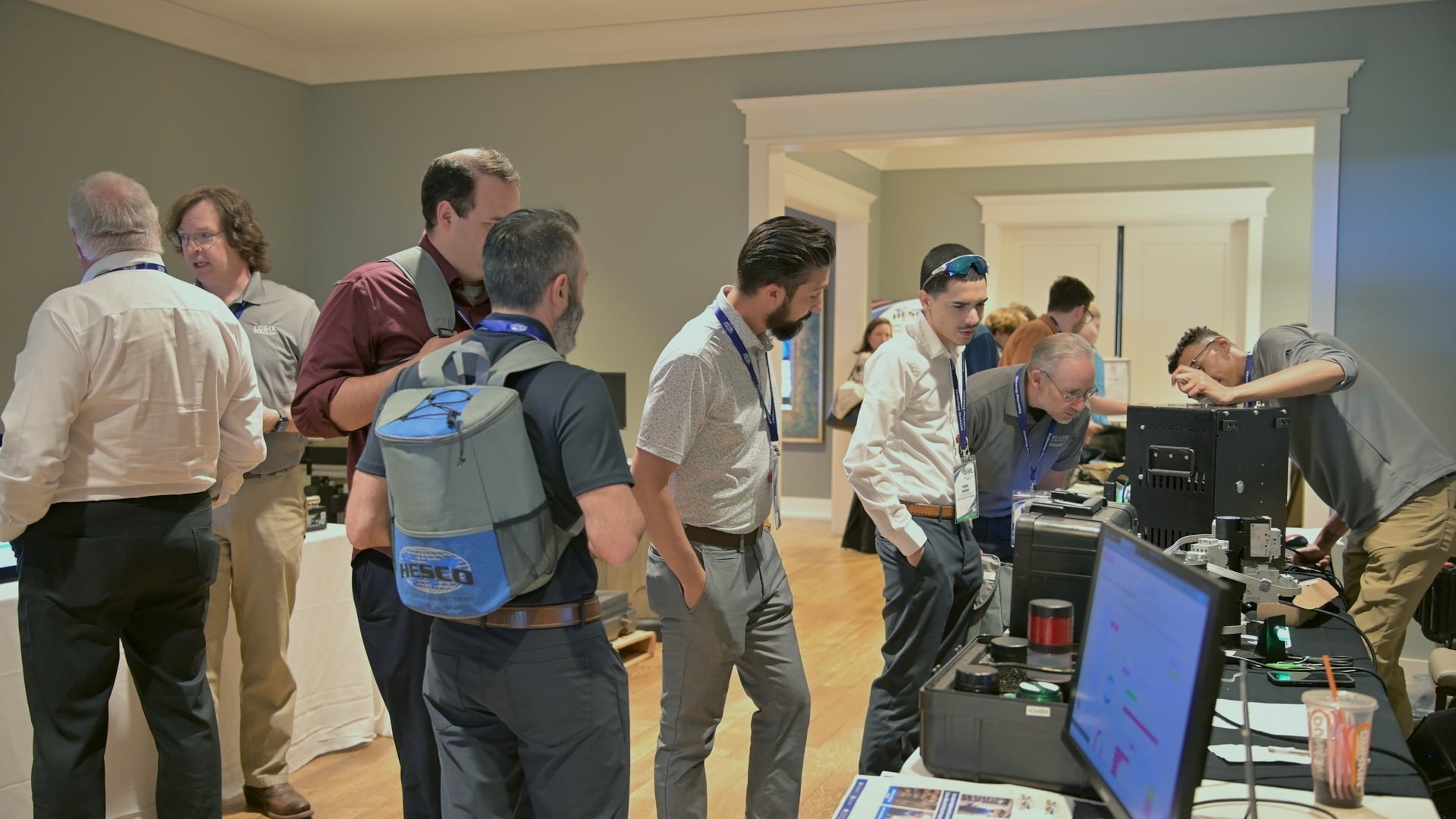 Attendees gather around a live equipment demonstration at the HESCO Technology Showcase